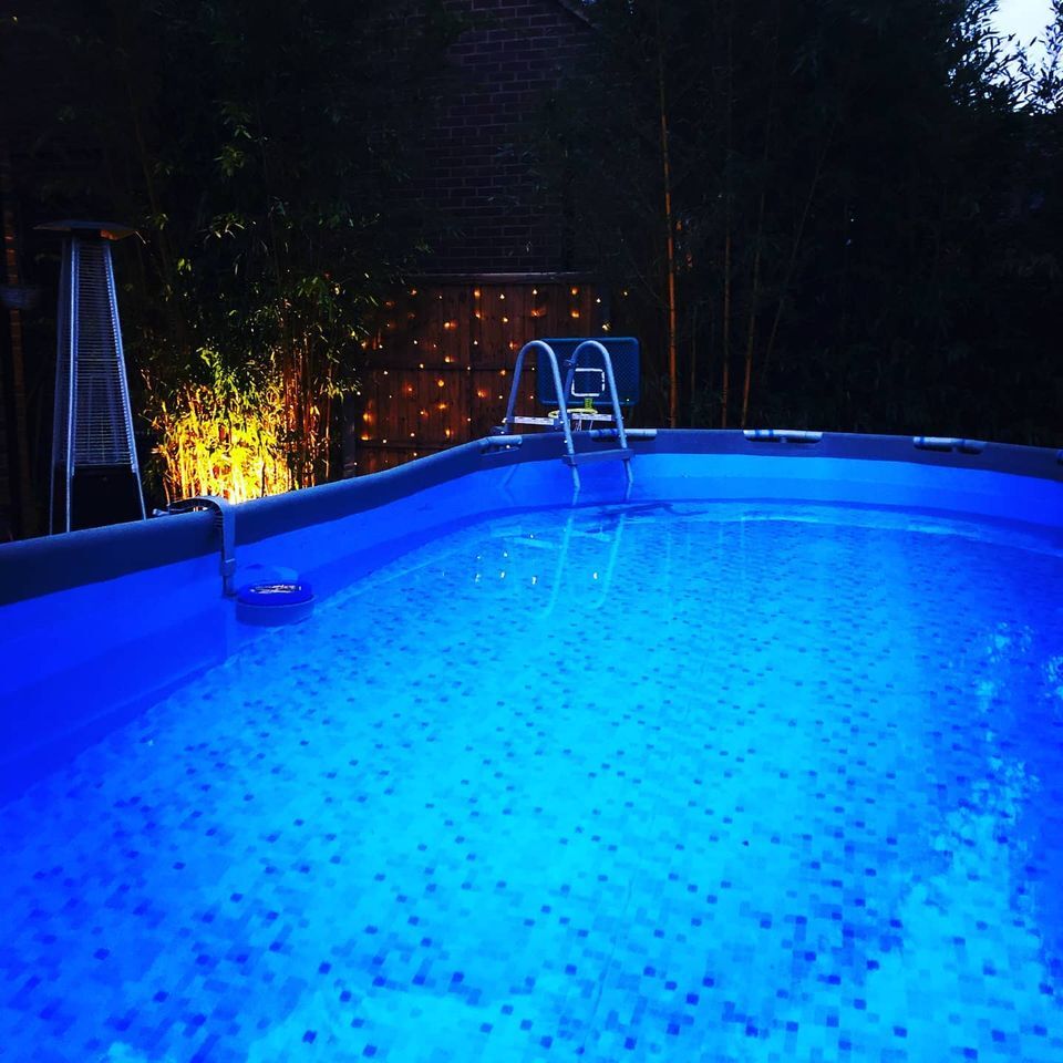 swimming pool pictured at night